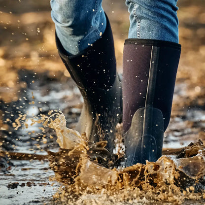 Rubbs Bearline 8.5 Wellington rubber boots splashing in muddy water for country clothing and hunting