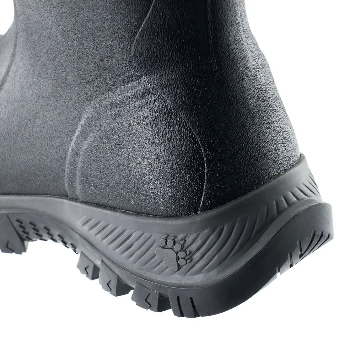 Close-up of Grubs Bearline waterproof boot heel with paw print logo for country clothing and hunting