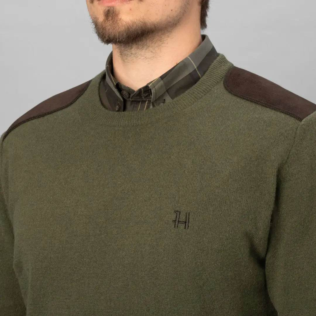 Olive green Härkila Arran Pullover with shoulder patches for country clothing and hunting