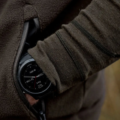 Black smartwatch in jacket pocket shown with Härkila Aspire Fleece Waistcoat for outdoor style