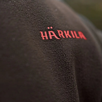Black fleece waistcoat with red Härkila logo from Aspire Fleece Waistcoat collection