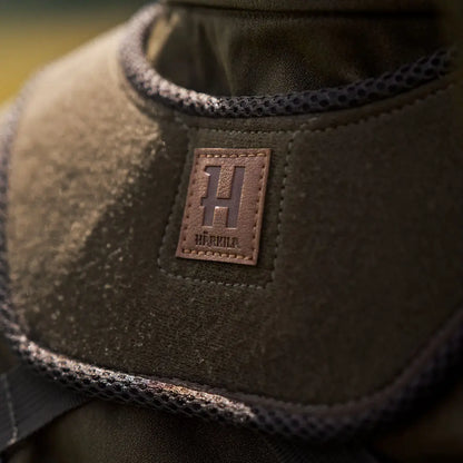 Olive green Harkila Bino Harness with brown logo, perfect for country clothing and hunting