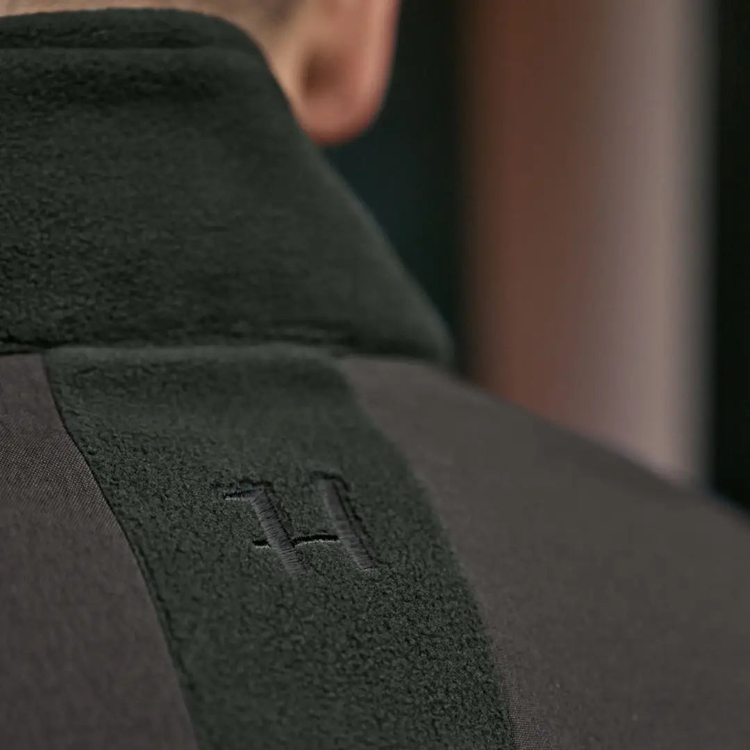 Dark fleece jacket with embroidered logo, perfect for Härkila Fjell Fleece Jacket fans