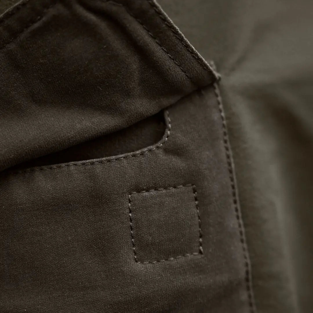 Olive green fabric pocket on Härkila Hill Trousers for hunting and country clothing