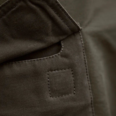 Olive green fabric pocket on Härkila Hill Trousers for hunting and country clothing
