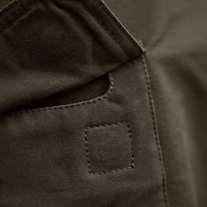 Olive green fabric pocket on Härkila Hill Trousers for hunting and country clothing