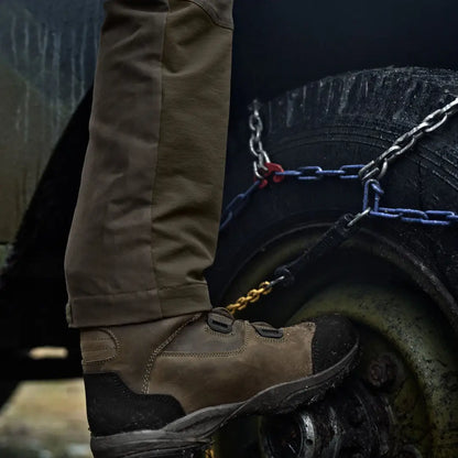 Brown leather work boot paired with Härkila Hill Trousers for hunting and country clothing