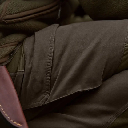 Olive green jacket paired with Härkila Hill Trousers, perfect for hunting and country clothing
