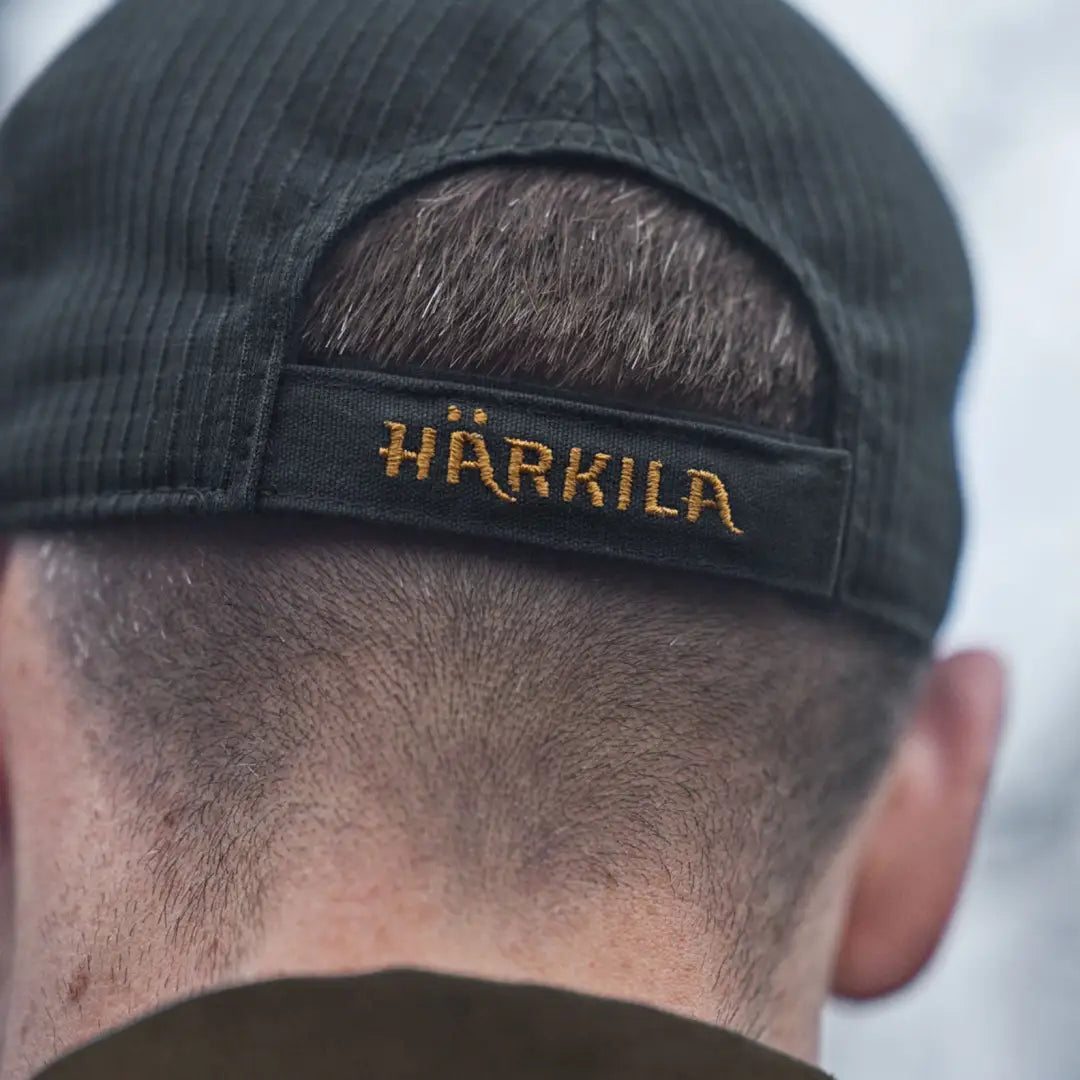 Dark corduroy härkila instinct cap with embroidered logo for stylish outdoor looks
