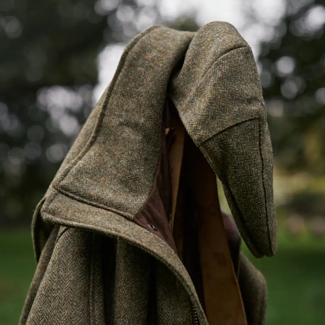 Green tweed jacket perfect for hunting and country clothing in the Härkila Kenmore Cl. Flat Cap style