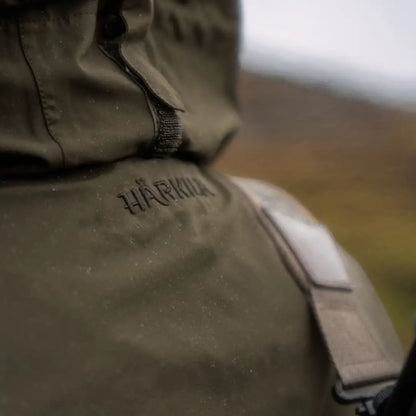 Olive green Härkila Orton Tech packable smock jacket for country clothing adventures
