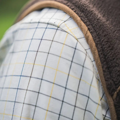 Härkila Portfield Long Sleeve Shirt with plaid pattern and brown fleece vest style