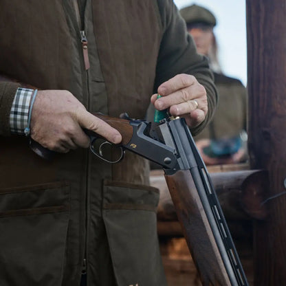 Open shotgun being loaded with Rannoch HSP Shooting Waistcoat for Rannoch HSP shooting