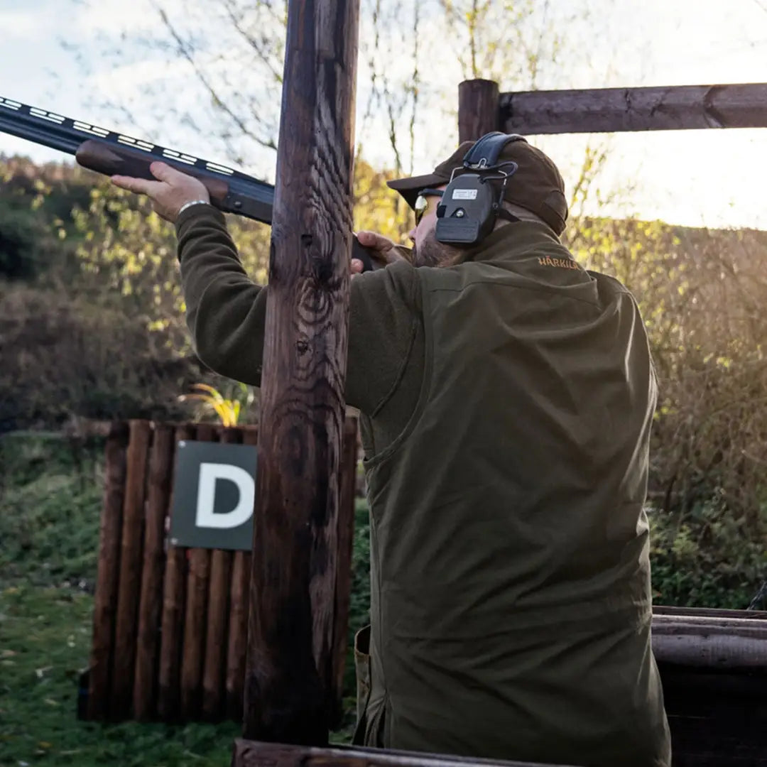 Man shooting with Härkila Rannoch HSP Shooting Waistcoat for rannoch hsp shooting style