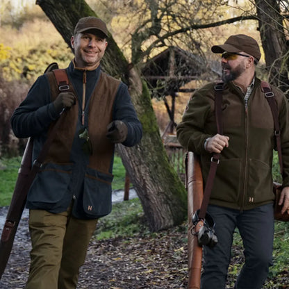 Two men in hunting attire wearing the Härkila Rannoch HSP Shooting Waistcoat