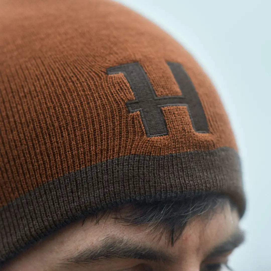 Brown knit beanie with dark brown H, Härkila Reversible Beanie for country clothing hunting