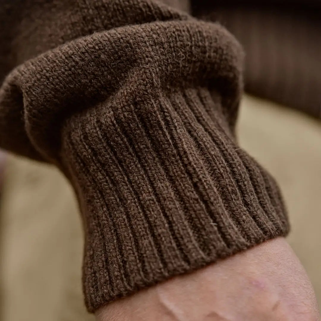 Brown ribbed knit sleeve on Härkila Vincent Merino Half Zip Pullover, a comfy half zip pullover