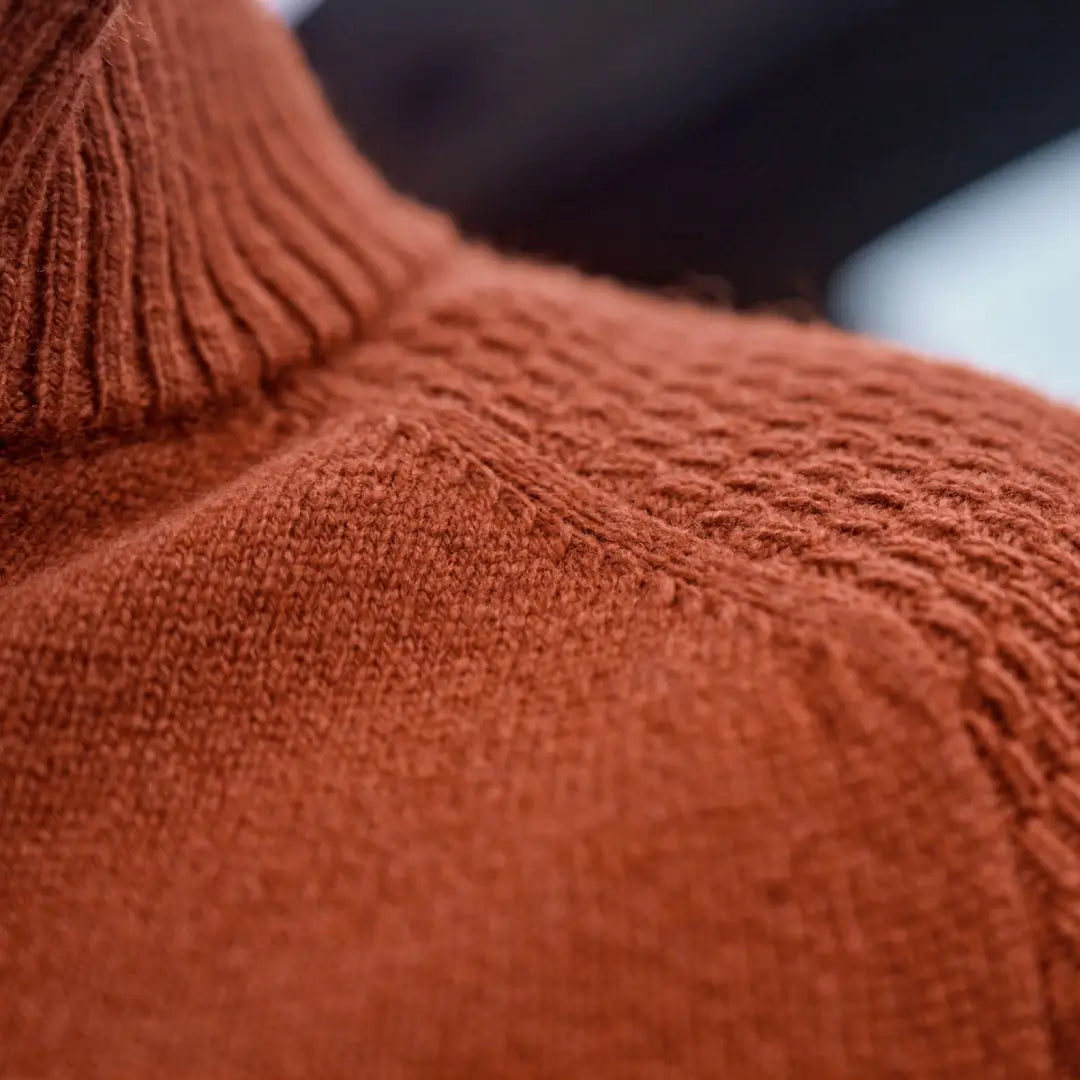 Rust-colored knit turtleneck sweater from Härkila Vincent Merino Half Zip Pullover collection