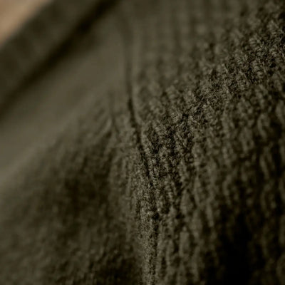 Textured dark green knit fabric from the Härkila Vincent Merino V-Neck Pullover