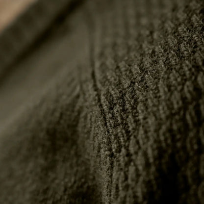 Textured dark green knit fabric from the Härkila Vincent Merino V-Neck Pullover