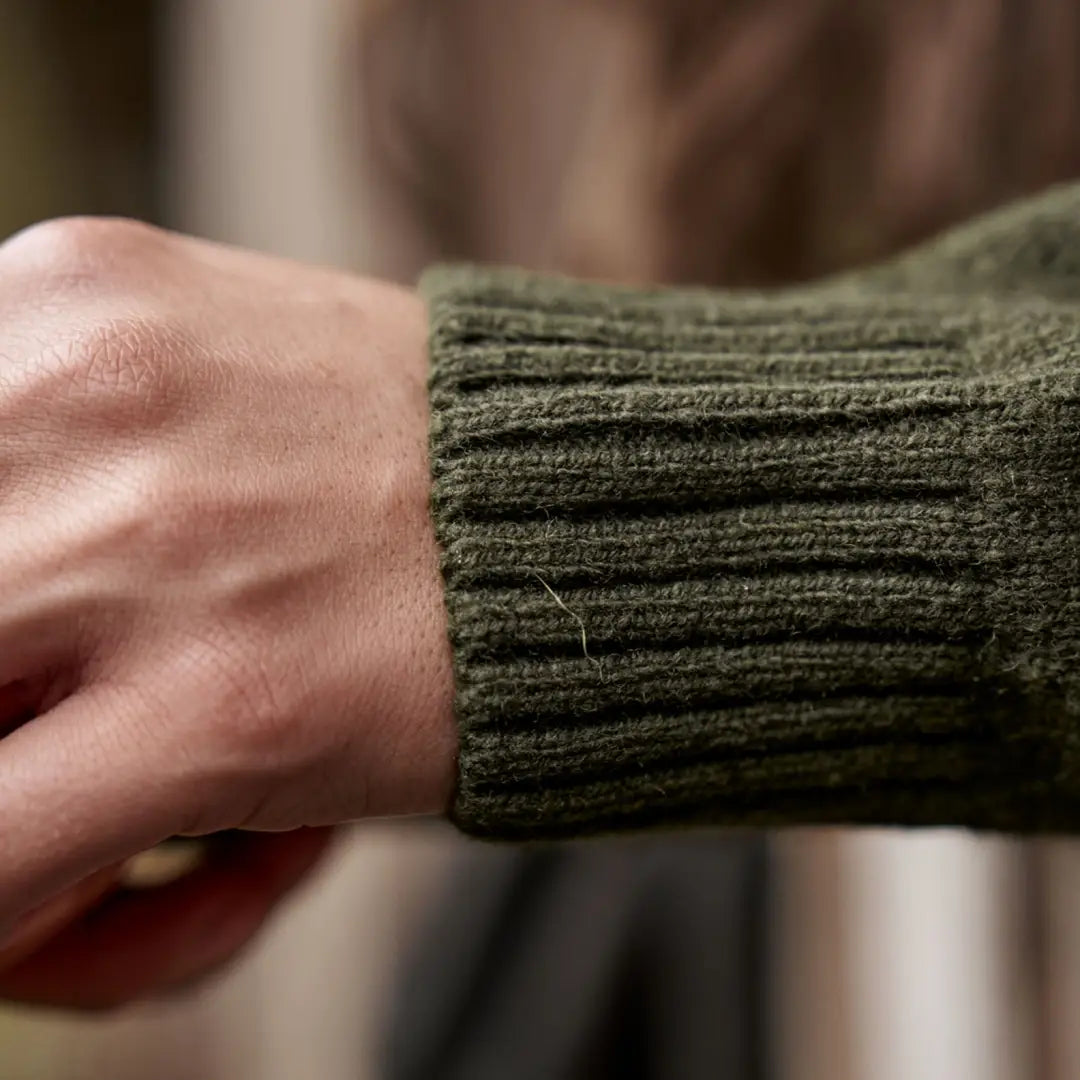Olive green ribbed knit cuff on Härkila Vinnie Womens Merino Pullover, ideal Vinnie Merino style