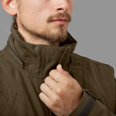 Olive green Harkila Driven Hunt HWS Insulated Jacket with high collar and zipper