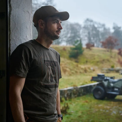 Man wearing Harkila H-logo Short Sleeve T-Shirt with cap, casual outdoors look