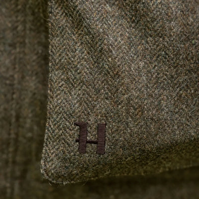 Green herringbone fabric with embroidered H on Kenmore GTX Jacket for style and durability