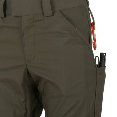 Olive green Helikon-Tex Woodsman Pants designed for outdoor enthusiasts with pockets and carabiner