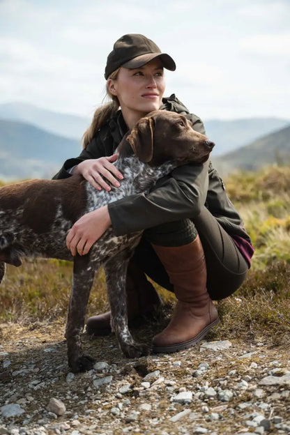 Olive green Hoggs of Fife Ardross Ladies 4-Way Active Jacket with brown leather boots