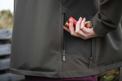 Olive green waterproof Hoggs of Fife Ardross Ladies 4-Way Active Jacket with brass zipper and red shotgun shell