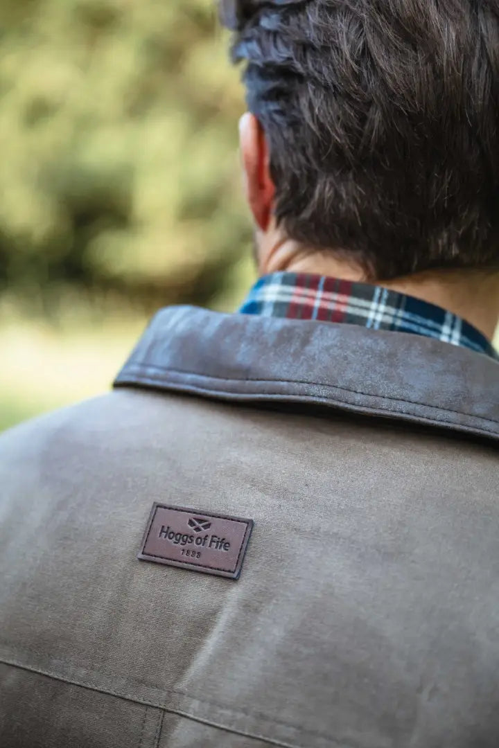 Brown leather jacket with Hoggs of Fife patch on collar, part of the Balerno waxed canvas barn coat collection