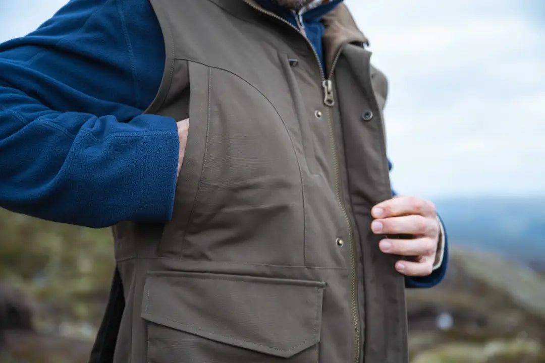 Olive green Hoggs of Fife Ballater waterproof field waistcoat with multiple pockets and hood