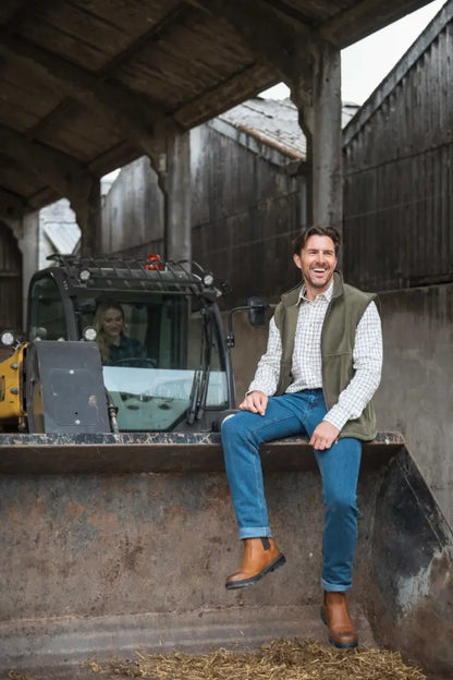Green vest with white shirt and blue jeans, showcasing Hoggs of Fife Classic D3 waterproof dealer boots