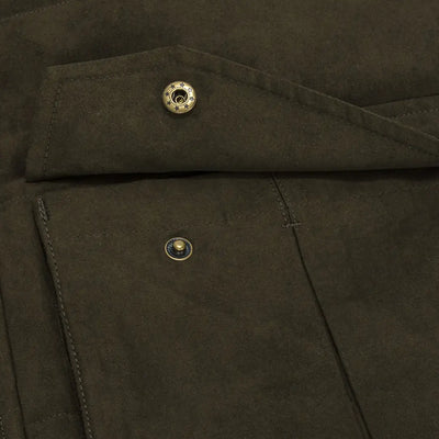 Dark green jacket pocket with metal snap buttons on Hoggs Of Fife Glenbervie Quilted Gilet