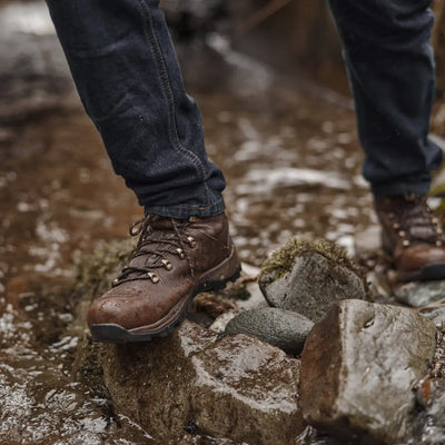 Rugged brown leather Fife Glencoe Waterproof Trek Boots on rocky terrain
