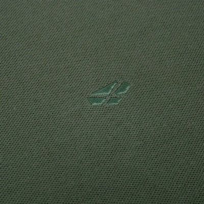 Green fabric featuring a small logo on the Hoggs Of Fife Largs Polo shirt