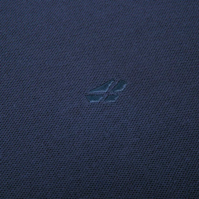 Navy blue fabric with a small logo on the Fife Largs Polo shirt by Hoggs of Fife