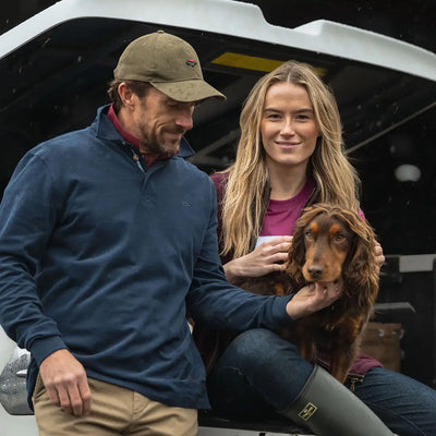 Couple with dog wearing Fife Moffat Rugby Shirt enjoying outdoor country clothing fun
