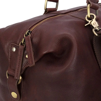 Close-up of Hoggs of Fife Monarch Leather Carryon Holdall in burgundy for country clothing and outdoors