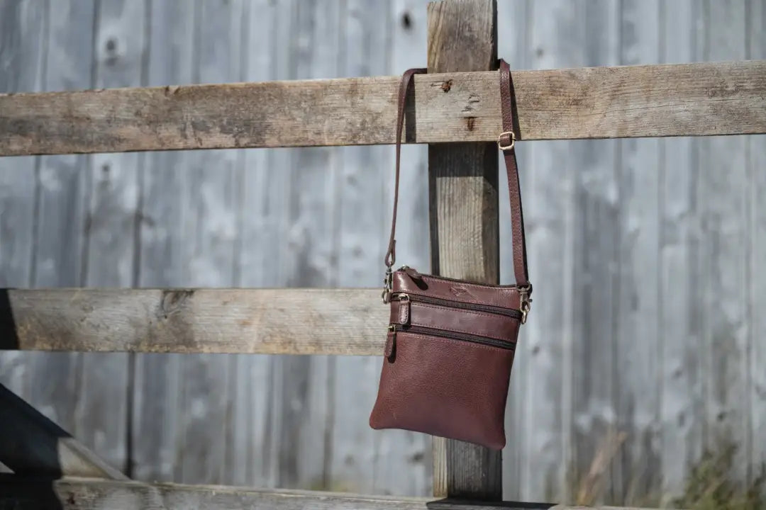 Brown leather crossbody bag with multiple pockets, adjustable strap, perfect for Hoggs of Fife Monarch Leather Travel Organiser