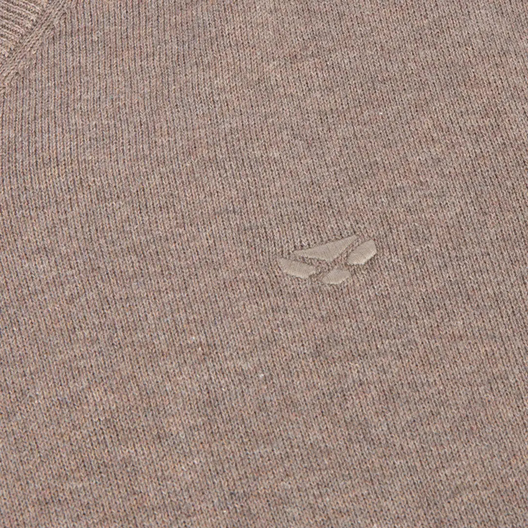 Close-up of light brown Hoggs of Fife Stirling II Pullover with embossed wolf paw logo and original Stirling cotton feel