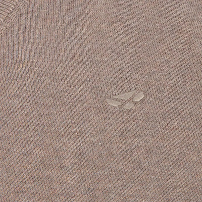 Close-up of light brown Hoggs of Fife Stirling II Pullover with embossed wolf paw logo and original Stirling cotton feel