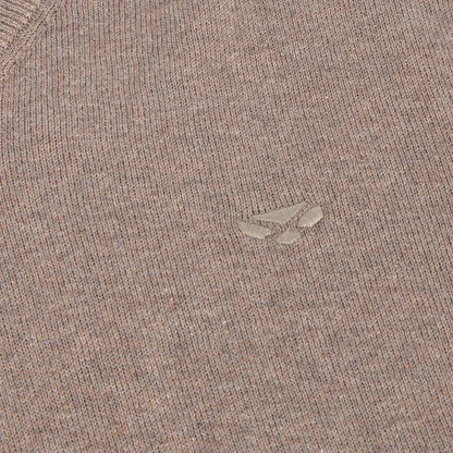 Close-up of light brown Hoggs of Fife Stirling II Pullover with embossed wolf paw logo and original Stirling cotton feel