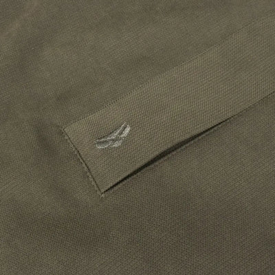 Olive green fabric of the Fife Struther Junior Smock with a bird-like logo