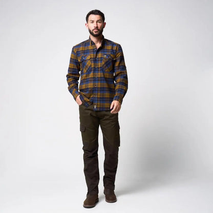 Man in Jack Pyke Bleasdale heavy flannel shirt, blue mustard plaid