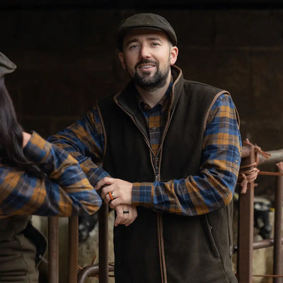 Man wearing Jack Pyke Bleasdale Heavy Flannel Shirt with brown vest and plaid design