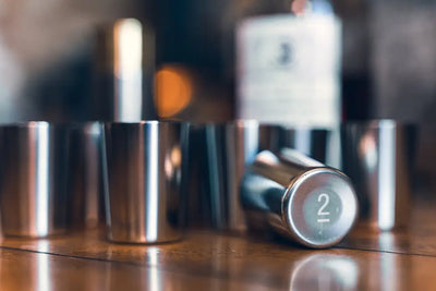Metal shot glasses in the Jack Pyke Cartridge Cup Set, perfect for outdoor fun