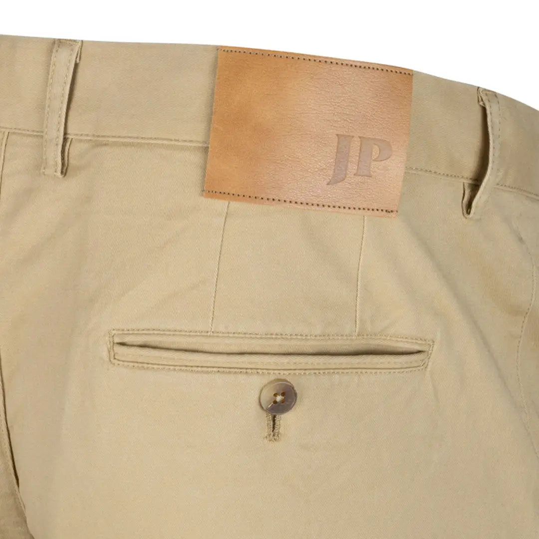 Jack Pyke Chino Trousers with khaki color and stylish leather patch detail