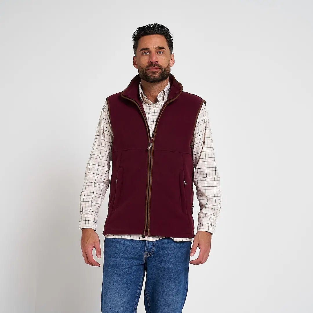 Maroon Jack Pyke Countryman Fleece Gilet with brown zipper trim and two lower zipped pockets in 300gsm micro fleece